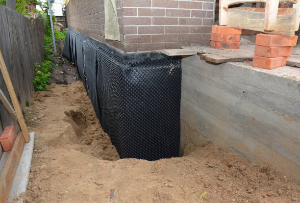 SJ Waterproofing Pros technician performing targeted Waterproofing assessment in Fruitport, MI